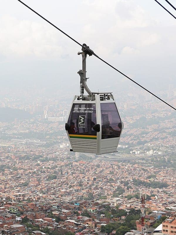 A Metrocable cabin above the hillsides of Medellín