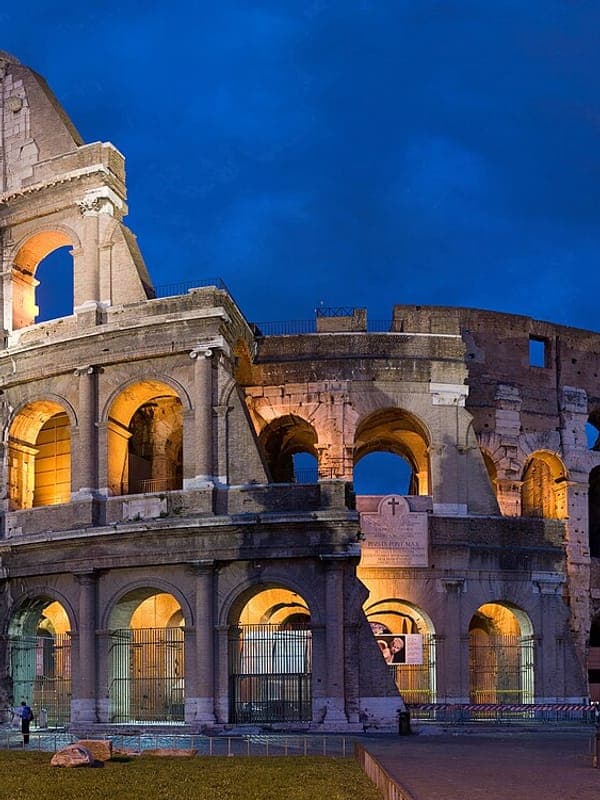The Colosseum in Rome lit up at dusk